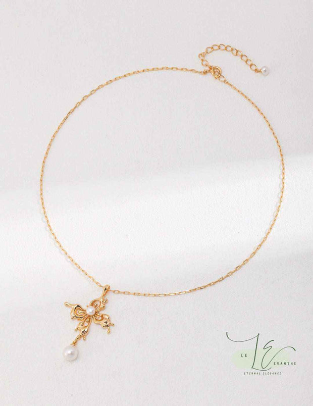 Close-up of Butterfly Pendant Necklace showcasing intricate wing engraving and premium pearl setting in sterling silver.