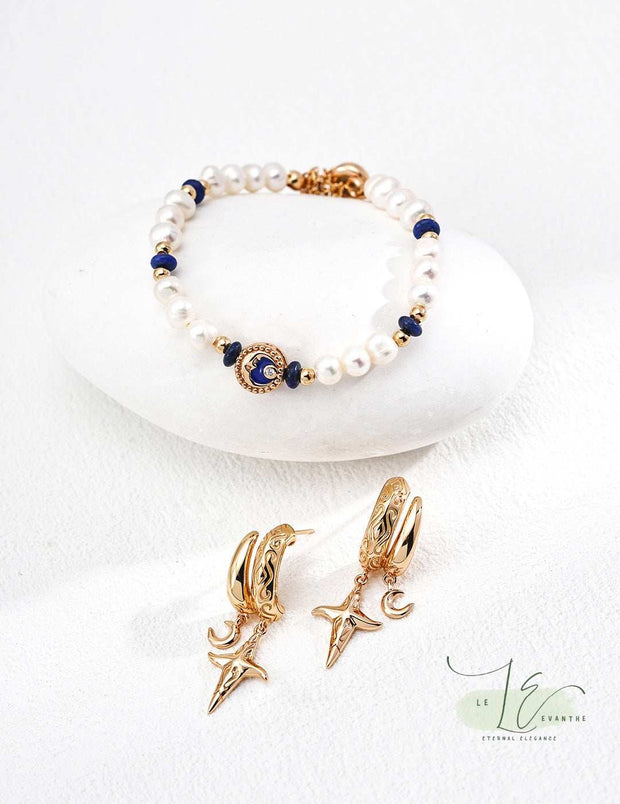 Model wearing the Moon Star Hoop Earrings, demonstrating their perfect 1.5" diameter – versatile for layering or standalone wear with a subtle celestial sparkle.