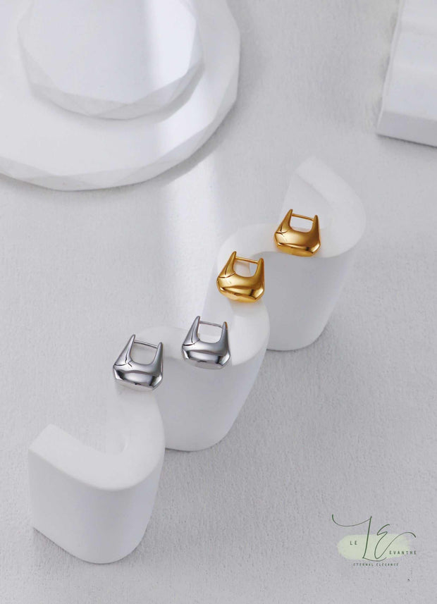 How-to video still: Adjusting Geometric Hoop Earrings' secure latch back. The ergonomic closure prevents snagging while keeping the architectural shape intact.