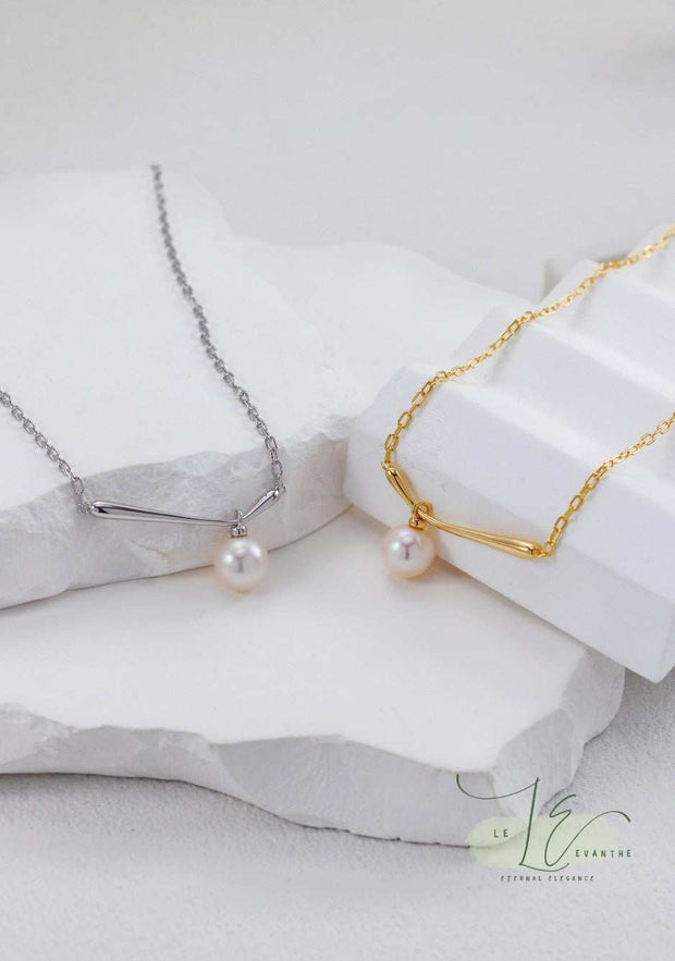 Elegant Minimalist Pearl Pendant Necklace featuring a single freshwater pearl on a delicate 925 Sterling Silver chain with 18K Gold accents. Perfect for everyday sophistication and layering.